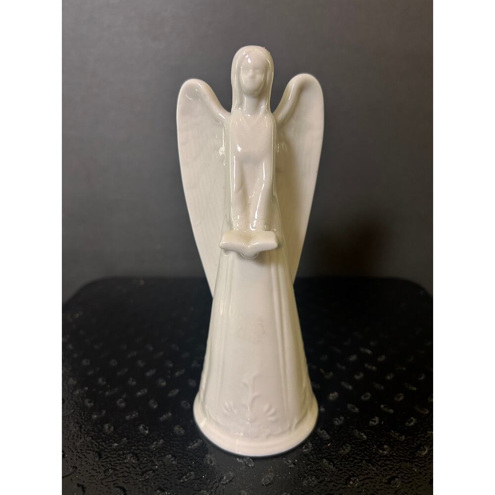 white glazed porcelain angel figurine by Lladró holding an open book